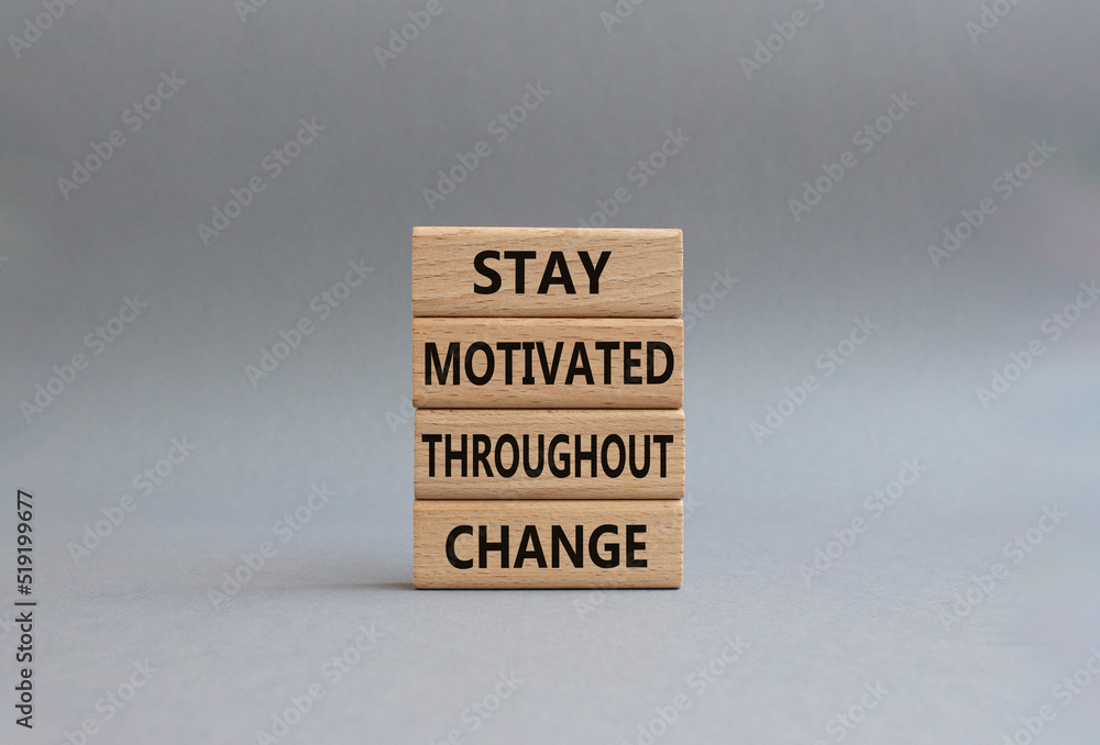 stay motivated throughout change symbol. Concept words stay motivated throughout change on wooden blocks. Beautiful grey background. Business concept. Copy space. stay motivated throughout change symbol. Concept words stay motivated throughout change on wooden blocks. Beautiful grey background. Business concept. Copy space.