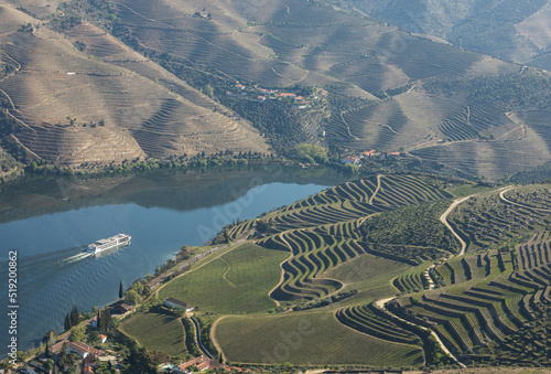 Cruise ship in Douro river and Alto Douro vineyards - UNESCO World Heritage