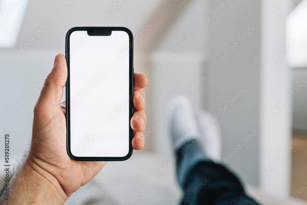 Smartphone mockup, internet of things and smart home concept, man using mobile phone Smartphone mockup, internet of things and smart home concept, man using mobile phone