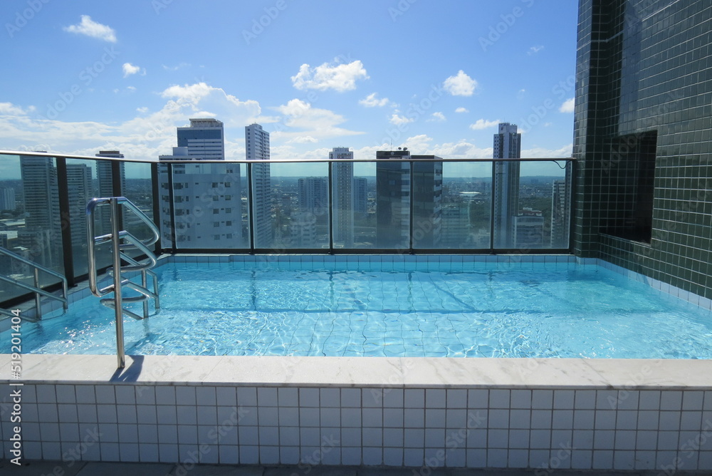 View of the Boa Viagem neighborhood, in Recife, from the top of the building. Sky and pool in a nice shade of blue.