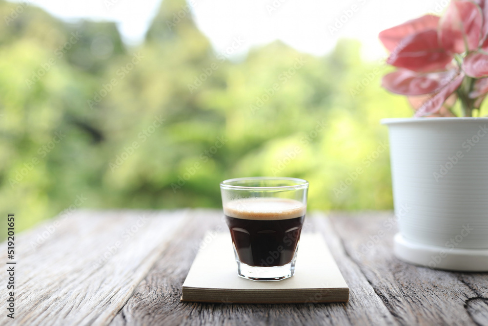 Glass coffee cup and notebook with plant pot Glass coffee cup and notebook with plant pot