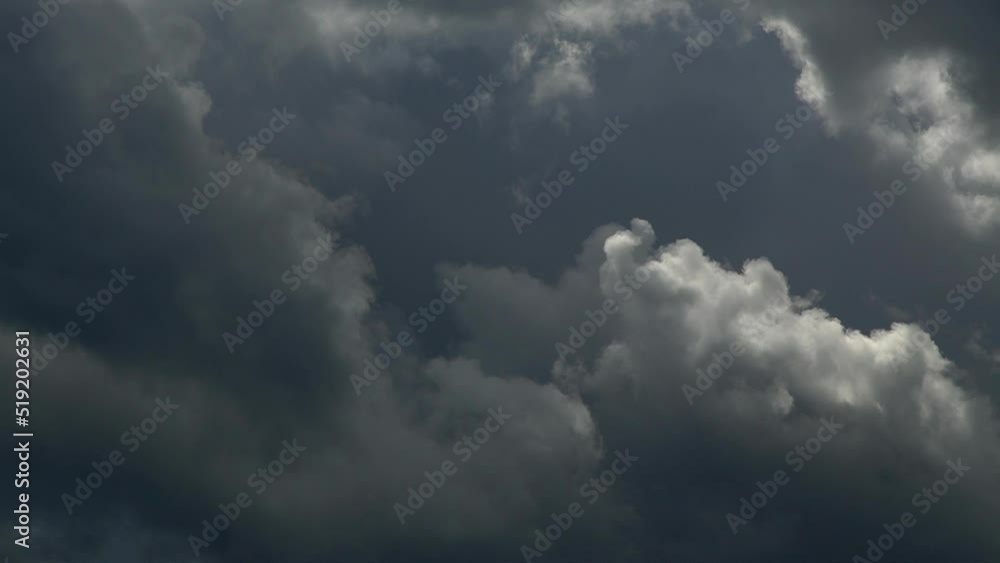 Dark storm clouds reveal a silver lining as they move past in this time lapse video. Dark storm clouds reveal a silver lining as they move past in this time lapse video.