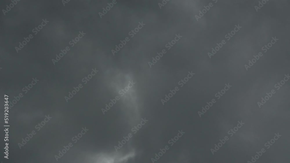 Dark storm clouds dissipate to reveal blue skies. Dark storm clouds dissipate to reveal blue skies.