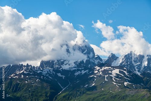 Beautiful mountains landscape. Clouds covering the top of Ushba mountain. Svaneti Geogria