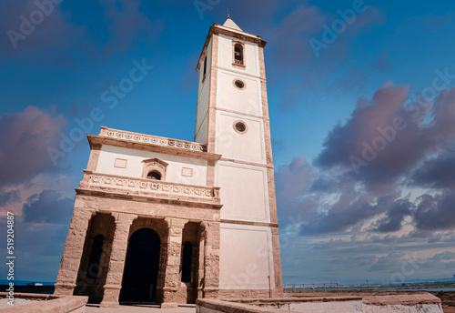 church Las Salinas of Cabo de Gata, built in year 1907, next to the road and the beach in Almadraba de Monteleva (Almeria, Andalusia, Spain, Europe) photo