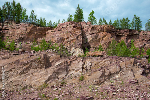 Old mining quarry for raspberry quartzite. Village Quartzitny (Shoksha), Karelia photo