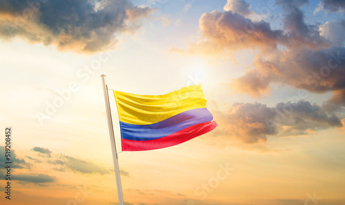 Colombia national flag cloth fabric waving on the sky - Image © Faraz