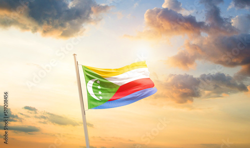 Comoros national flag cloth fabric waving on the sky - Image © Faraz