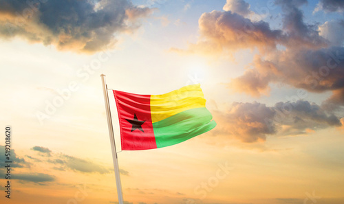Guinea-Bissau national flag cloth fabric waving on the sky - Image