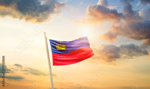 Liechtenstein national flag cloth fabric waving on the sky - Image photo