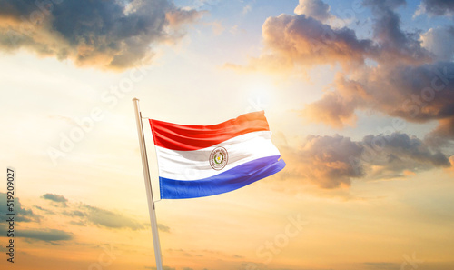 Paraguay national flag cloth fabric waving on the sky - Image