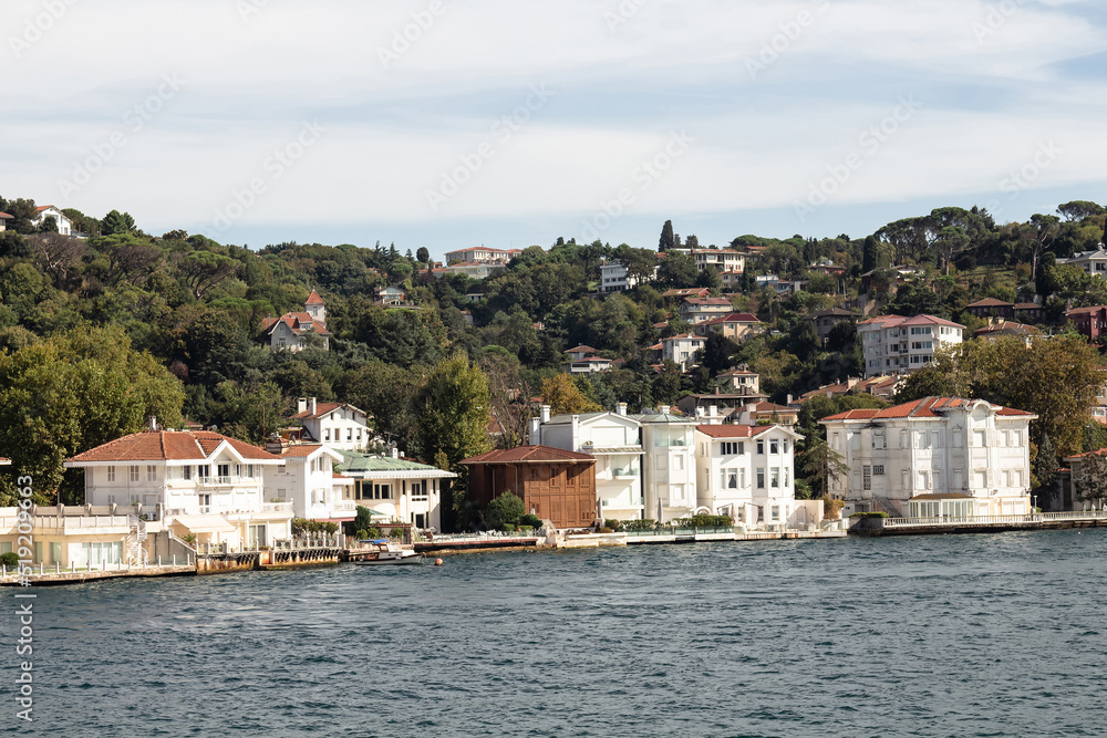 View of historical, traditional mansions by Bosphorus in Kanlica area of Asian side of Istanbul. It is a sunny summer day. Beautiful travel scene.