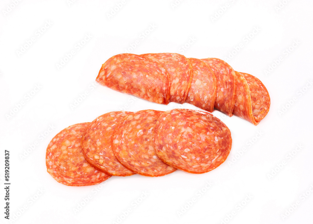 Salami slices, isolated. Meat cold cuts on a white background. Packshot photo. Salami slices, isolated. Meat cold cuts on a white background. Packshot photo.