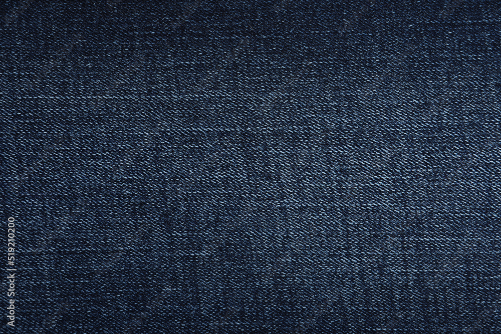 Texture of dark blue jeans as background, closeup Texture of dark blue jeans as background, closeup