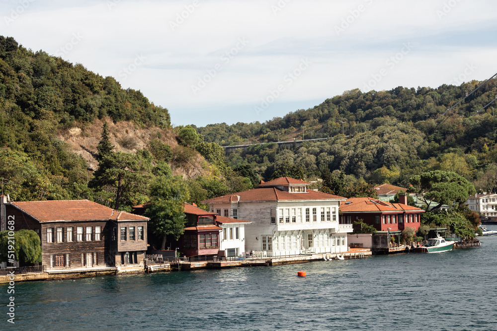 View of historical, traditional mansions by Bosphorus in Kanlica area of Asian side of Istanbul. It is a sunny summer day. Beautiful travel scene.