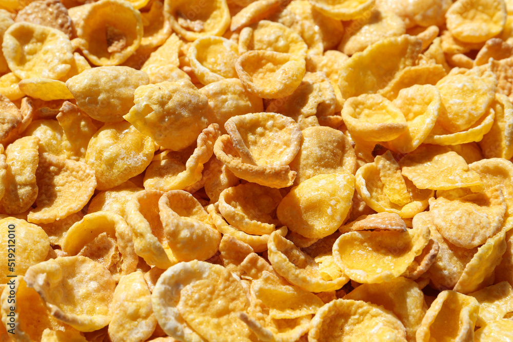 Crispy corn flakes as background, closeup view Crispy corn flakes as background, closeup view