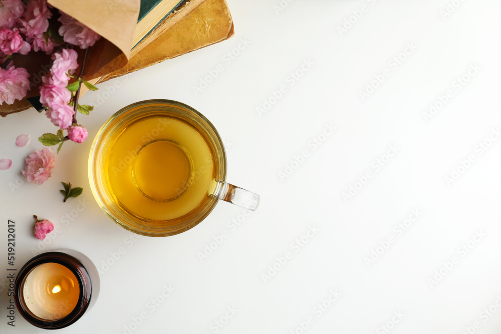 Flat lay composition with cup of freshly brewed tea on light table. Space for text Flat lay composition with cup of freshly brewed tea on light table. Space for text