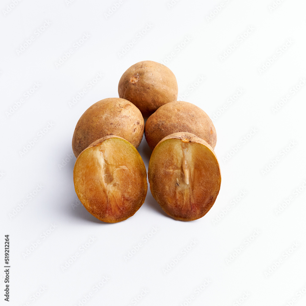Fototapeta premium Sapodilla and fresh fruit isolated on a white background