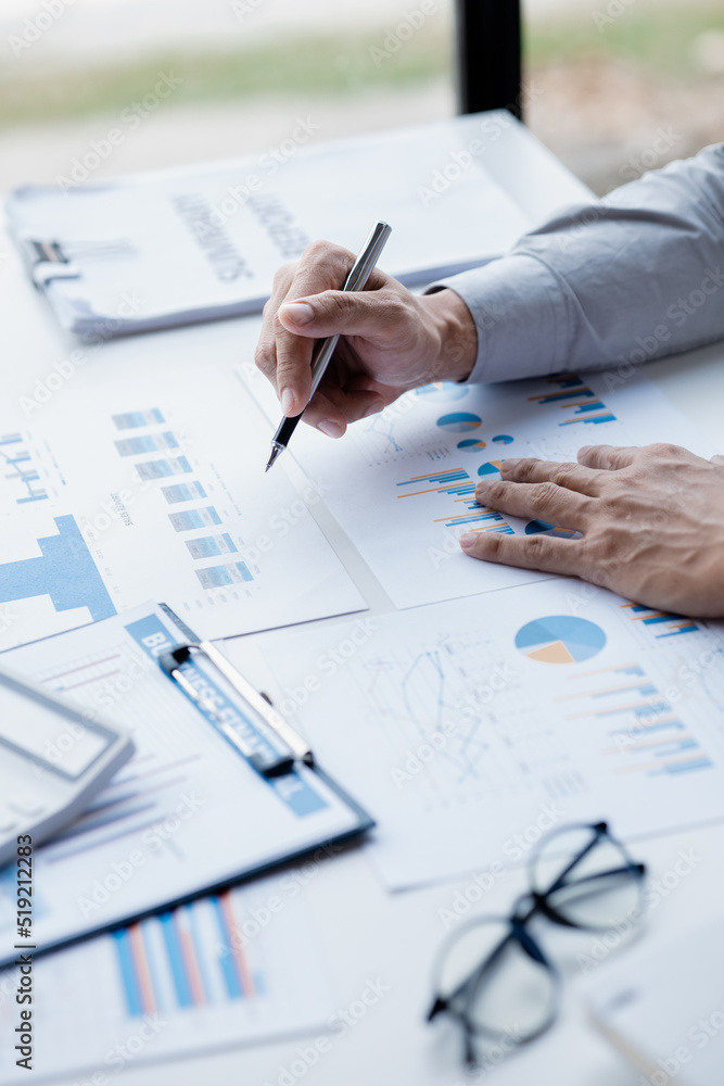 A female financier is reviewing company financial documents, monthly financial statement summary from the finance department. The concept of managing the company's finances for accuracy and growth. A female financier is reviewing company financial documents, monthly financial statement summary from the finance department. The concept of managing the company's finances for accuracy and growth.
