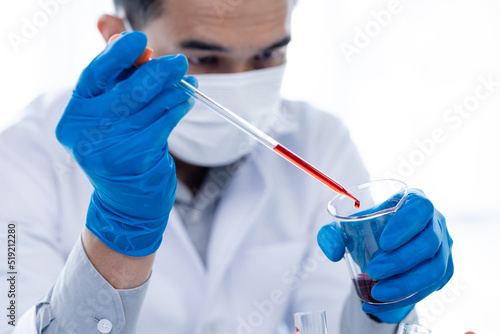 Laboratory assistants are investigating chemical reactions, medical scientists, chemical researchers, chemical experiments and disease testing from patient blood samples. Medicine and research concept