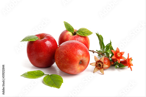Red apples with pomegranate flowers and fruits on white background, Rosh Hashanah (Jewish New Year holiday) concept.
