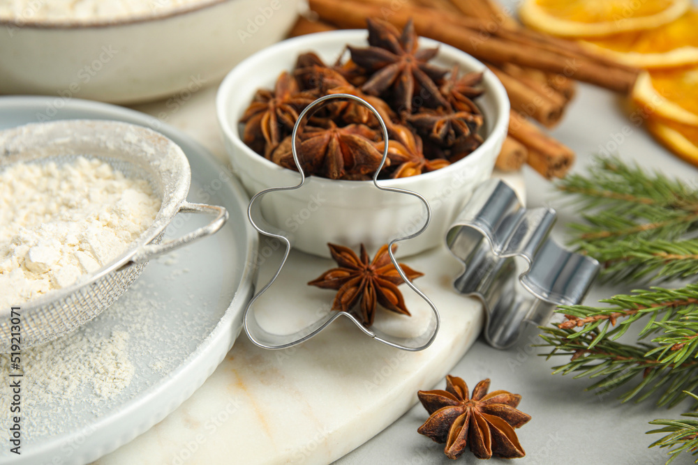 Cookies cutters and anise on white table, closeup. Christmas biscuits Cookies cutters and anise on white table, closeup. Christmas biscuits