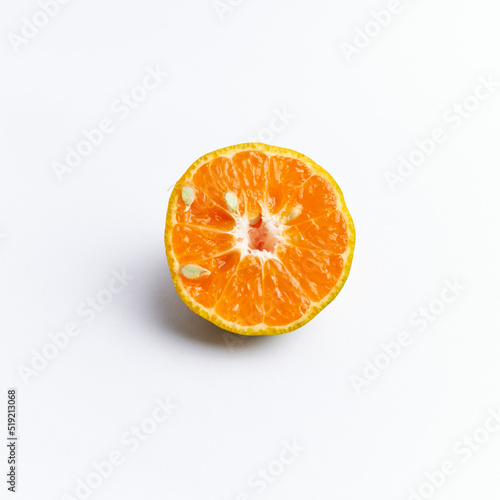 Close-up of freshly cut orange fruit isolated on white background