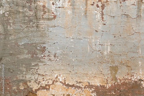 Old rustic wall with worn out peeling paint