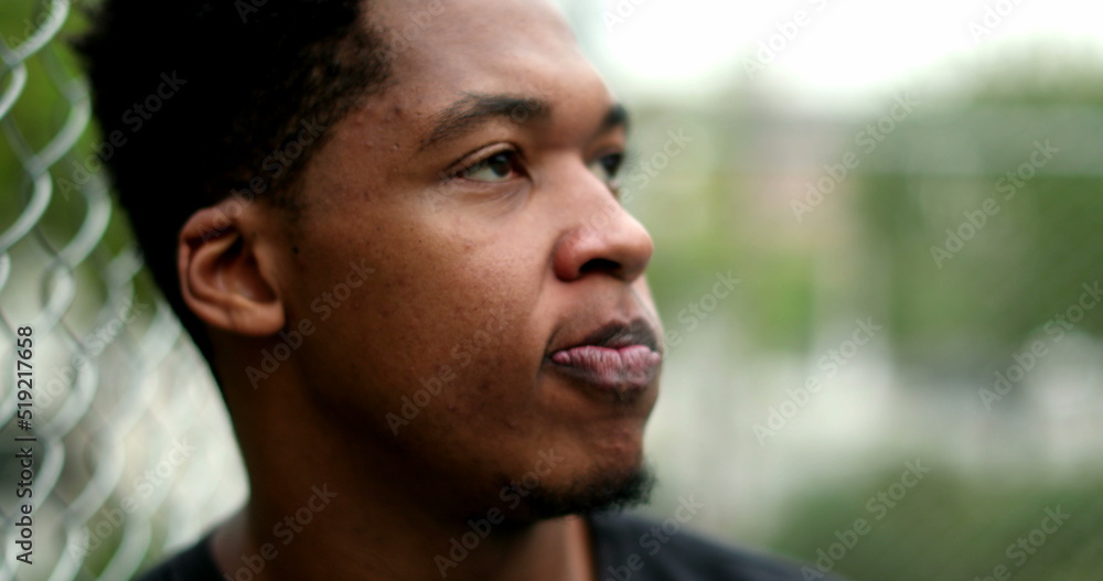 Stressed African man thinking outside. young black guy having doubts Stressed African man thinking outside. young black guy having doubts