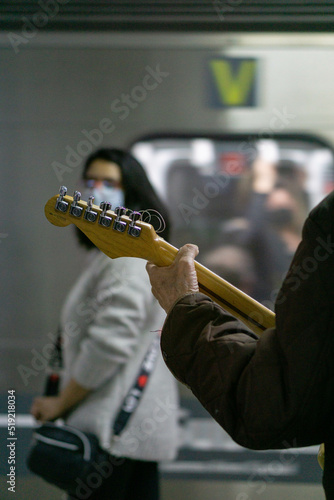 Man playing guitar in a subway station in Buenos Aires, Argentina