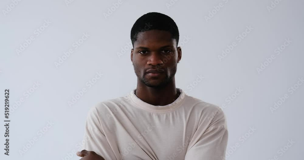 Serious African American young man over white background Serious African American young man over white background