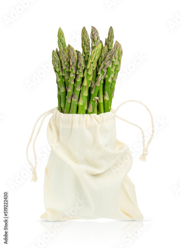Bunch of green raw asparagus in bag isolated on white background with clipping path.