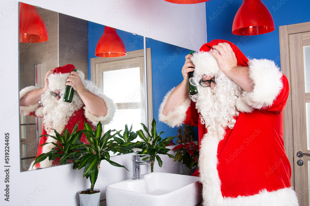 Fototapeta premium Alcohol and hangovers. Santa Claus in the bathroom. 