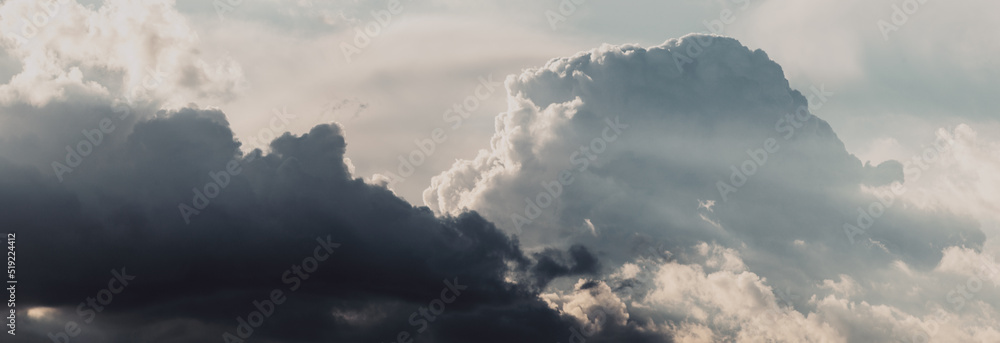 Obraz premium Sky panorama. Beautiful dramatic big clouds in the sky. Landscape of the power of heaven and nature. Copy space