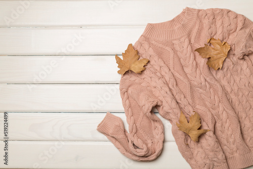 Flat lay of women's stylish autumn outfit on wooden background, top view © Liami