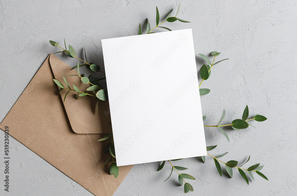 Wedding invitation card mockup with envelope and natural eucalyptus twigs - obrazy, fototapety, plakaty 