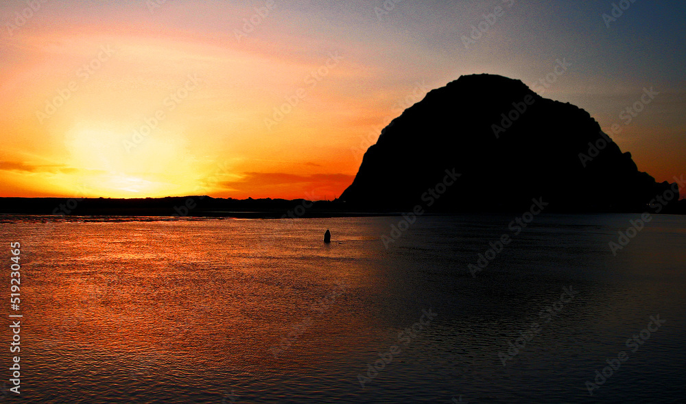 Sunset behind Morro Rock in Morro Bay, CA Sunset behind Morro Rock in Morro Bay, CA