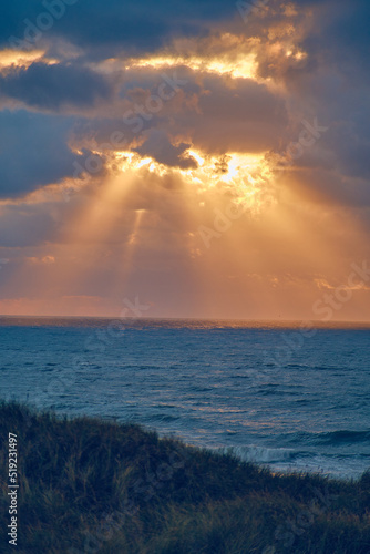 Sunset over the north sea with sunbeams. High quality photo