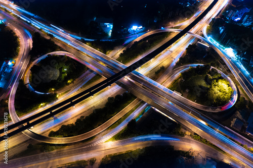 Expressway top view, Road traffic an important infrastructure,car traffic transportation above intersection road in city night, aerial view cityscape of advanced innovation, financial technology	 photo