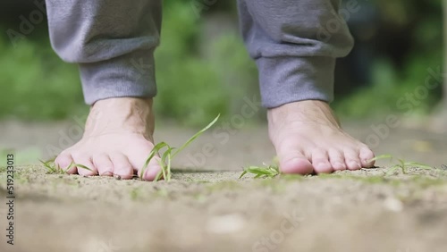Close-up of caucasian male feet jumping barefoot on skipping rope