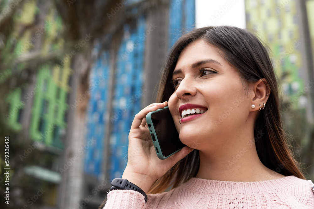 girl talking on the cell phone with on the street girl talking on the cell phone with on the street