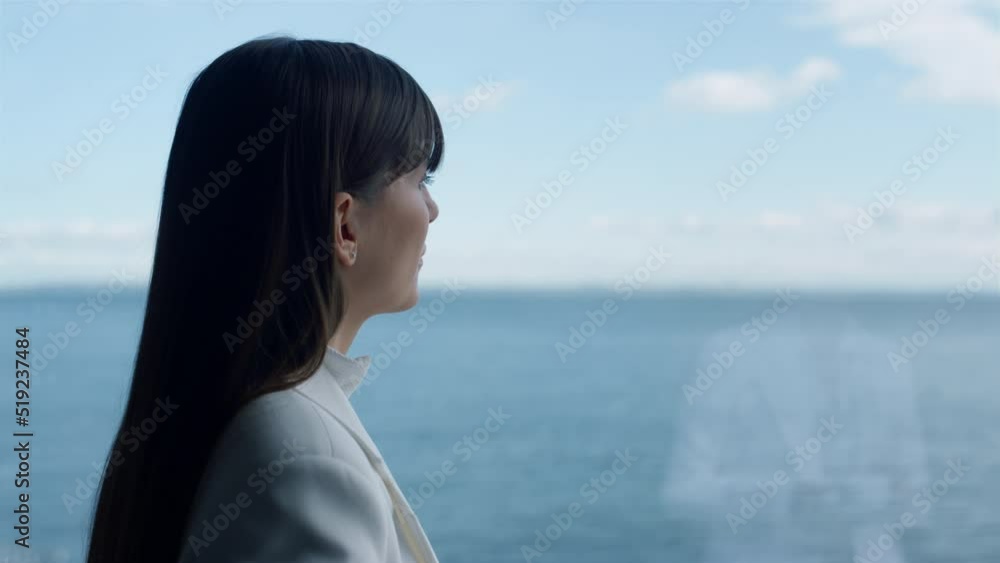 Closeup woman director thinking ocean window view. Luxury vacation concept Closeup woman director thinking ocean window view. Luxury vacation concept