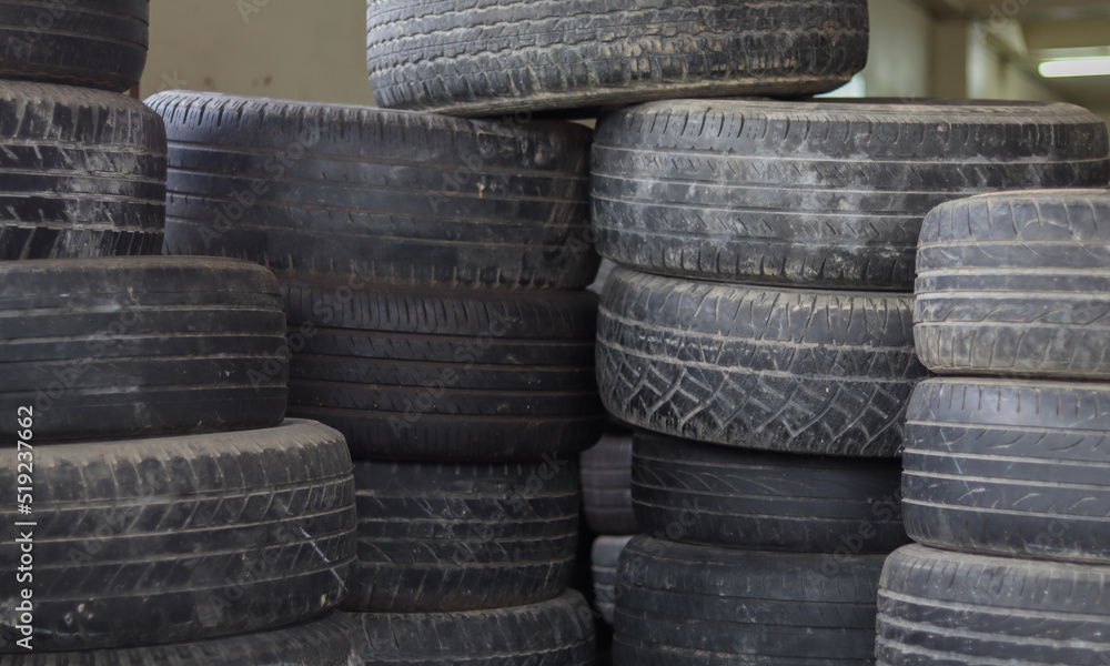 used car tires stacked together in layers used car tires stacked together in layers