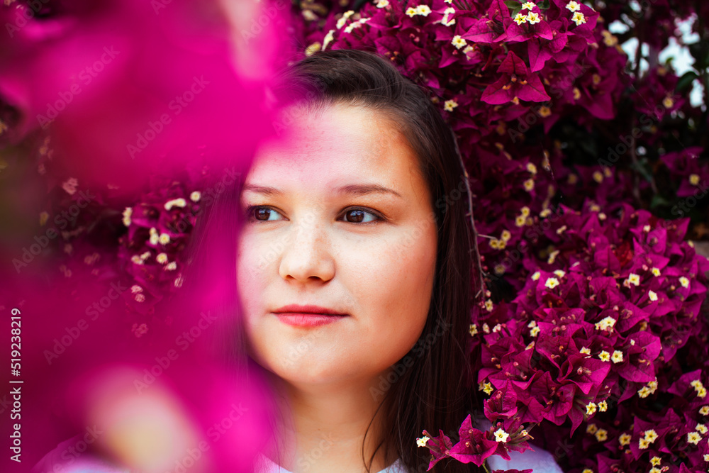 young pretty brunette girl surrounded by purple flowers, lifstyle people touristic season young pretty brunette girl surrounded by purple flowers, lifstyle people touristic season