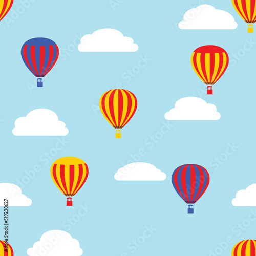 Cartoon hot air balloons and clouds on a light blue background, seamless pattern