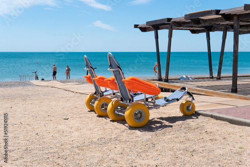 Swimming bathing handicapped people wheelchair stroller disabled disabilities young view, for move person in travel for talking beach, female guilty. Landscape mobility lonely,