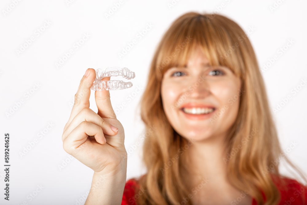 Beautiful smiling young woman with aligner. Beautiful smiling young woman with aligner.