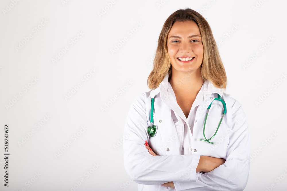 Happy young woman doctor portrait in studio. Happy young woman doctor portrait in studio.