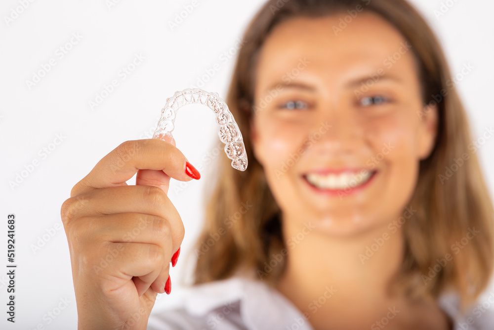 Beautiful smiling young woman with aligner. Beautiful smiling young woman with aligner.