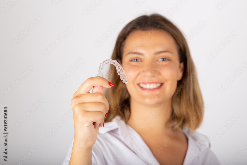 Beautiful smiling young woman with aligner. Beautiful smiling young woman with aligner.